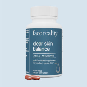 Face Reality clear skin balance supplements product with red pills in front on a light blue background.