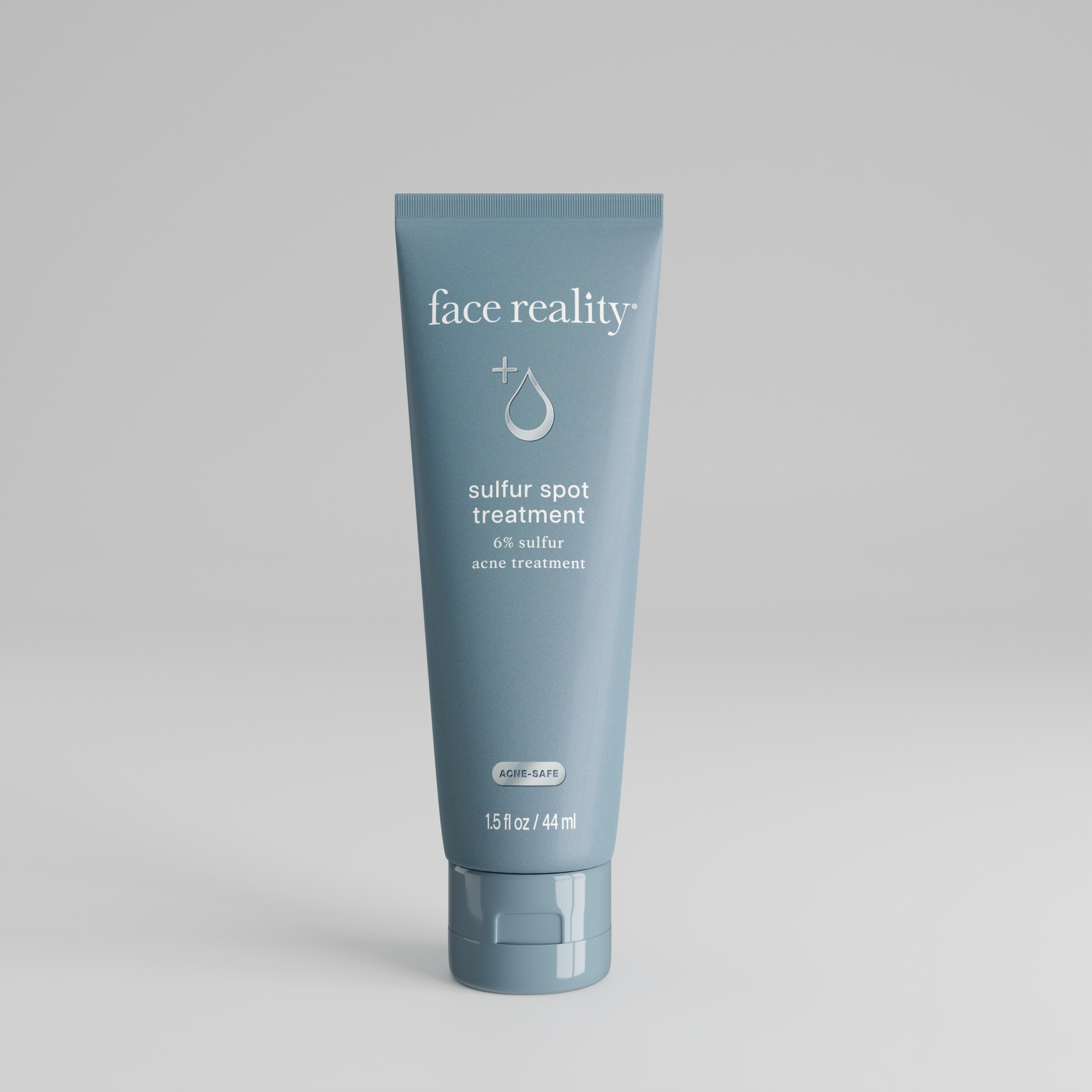 Grey blue 1 point 5 ounce bottle of Face Reality sulfur spot treatment product with acne-safe stamp on bottle standing alone on a light grey background.