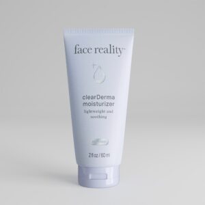 Light blue two ounce bottle of Face Reality clearderma moisturizer product with acne-safe stamp standing alone on a light grey background.