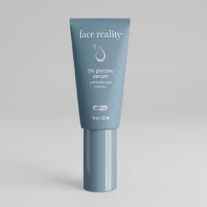 Grey blue one ounce bottle of Face Reality 5% glycolic serum product with acne-safe stamp standing alone on a light grey background.